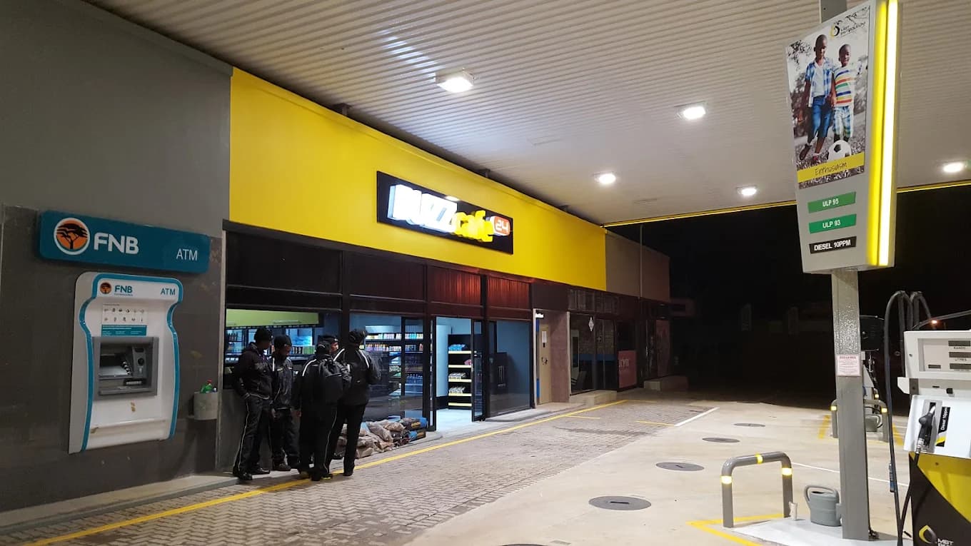 BUZZ Café storefront at MBT Poppys Ventersdorp lit up at night