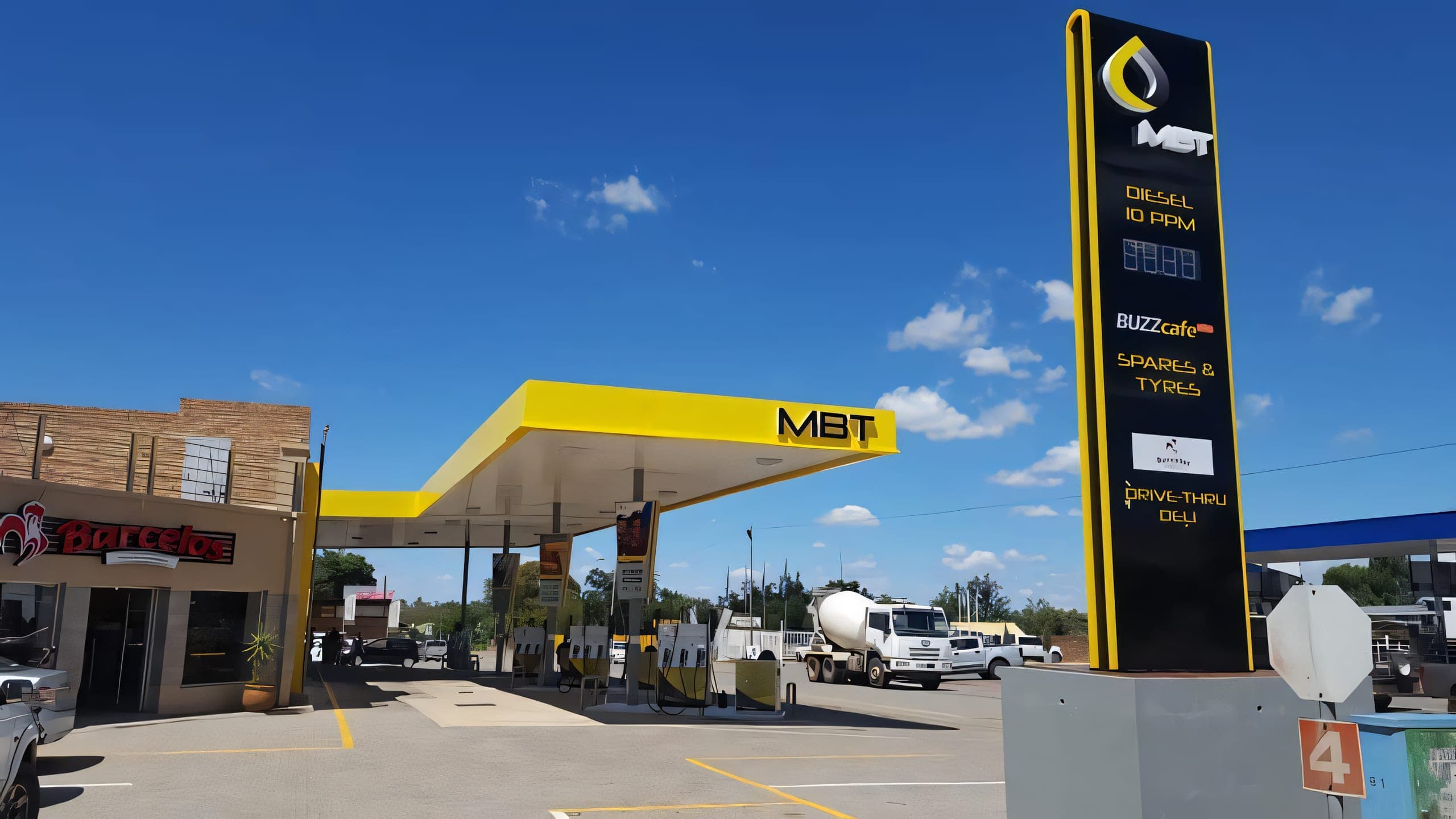 MBT Poppys Ventersdorp fuel station canopy lit up at night, 38 Hendrik Potgieter Street Ventersdorp